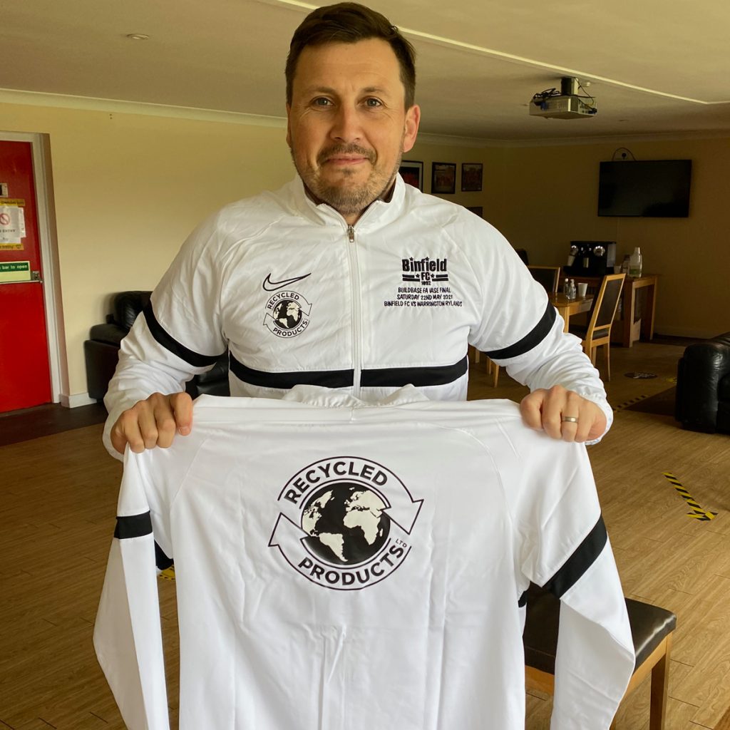 Binfield FC manager Carl Withers with the jackets sponsored by Recycled Products