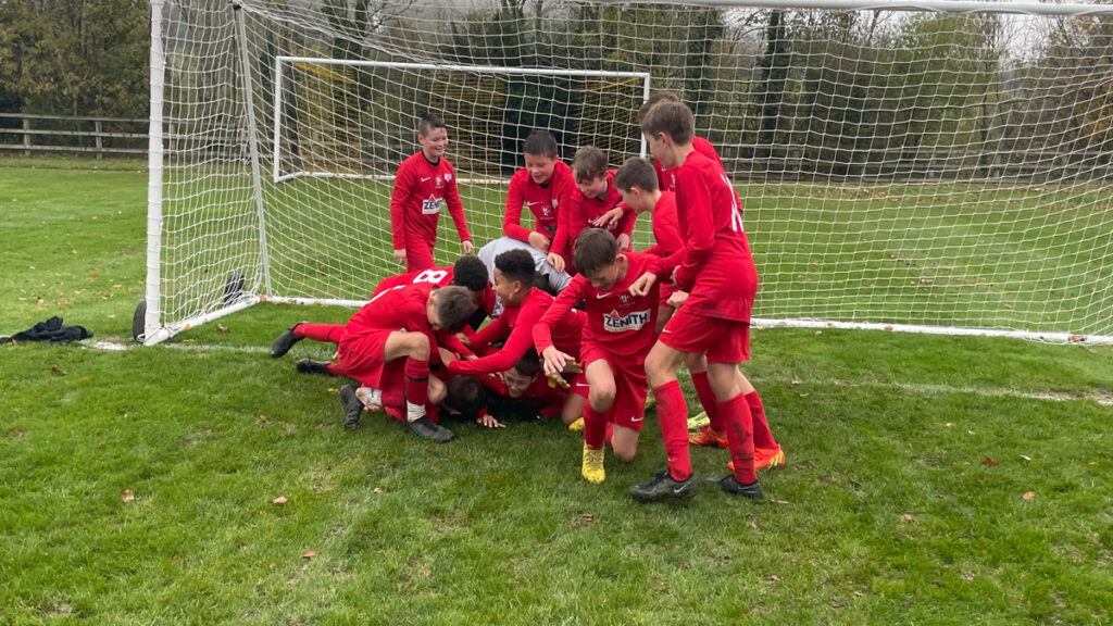 The Binfield u13 Reds enjoy a bundle.